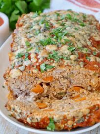 sliced cooked buffalo chicken meatloaf on plate