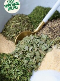 Greek dried herbs and spices in bowl with spoon