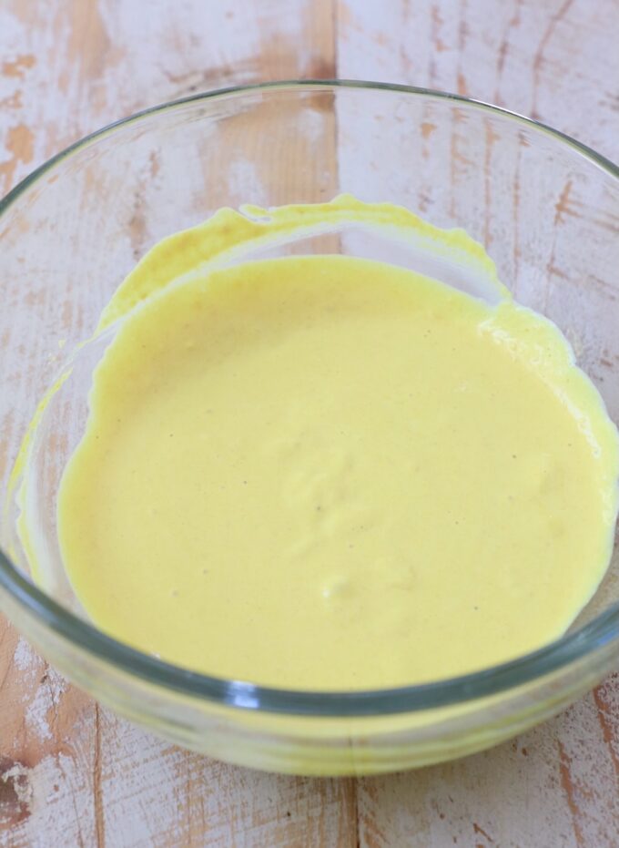 mayonnaise and mustard combined in a small glass bowl