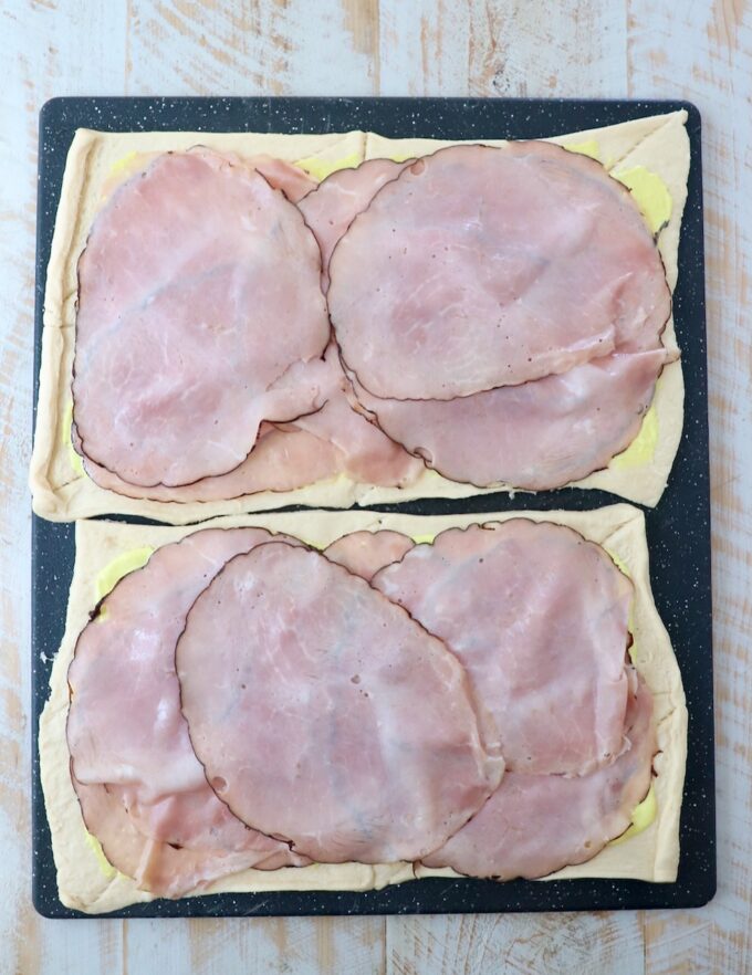 crescent roll dough sheets topped with sliced ham