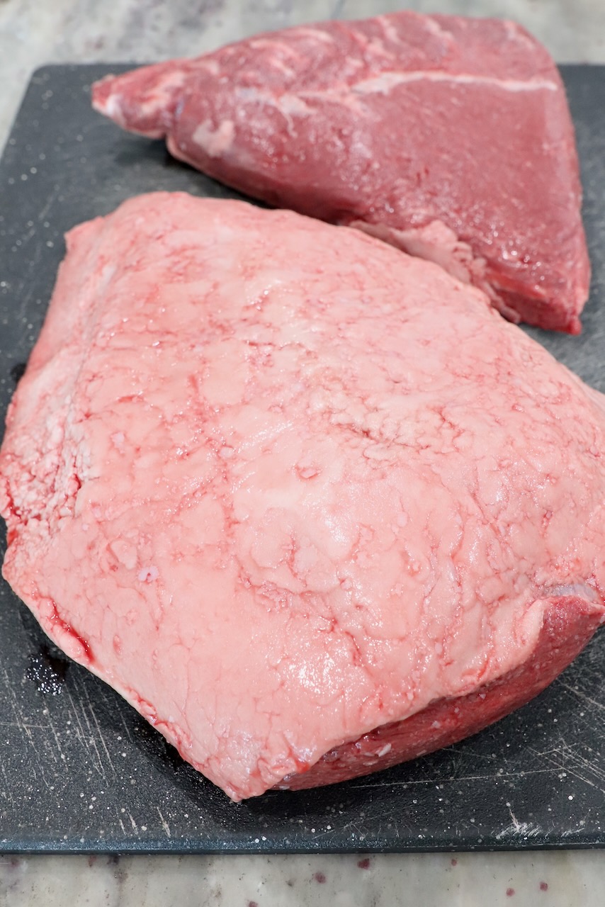 sirloin cap steaks on cutting board