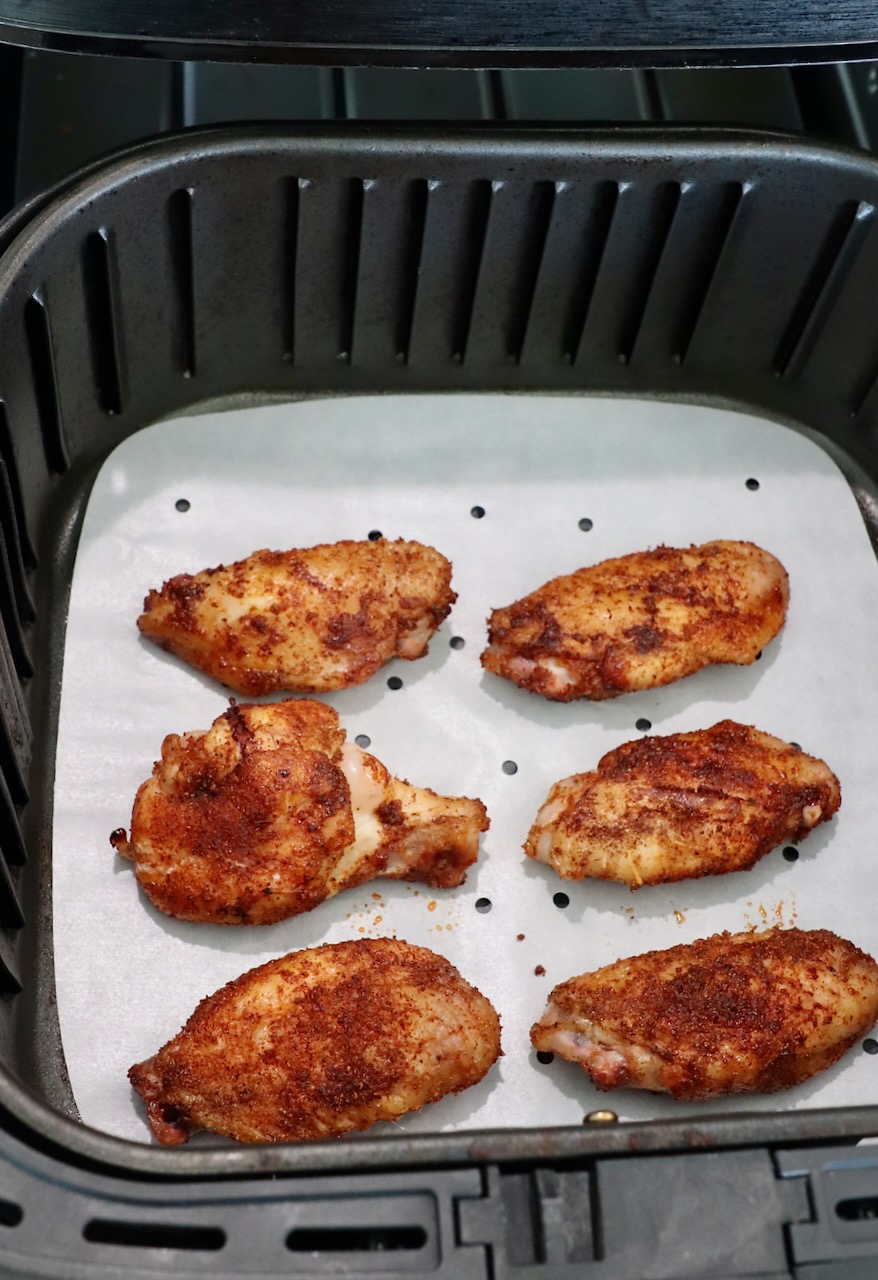 seasoned, smoked chicken wings in air fryer basket