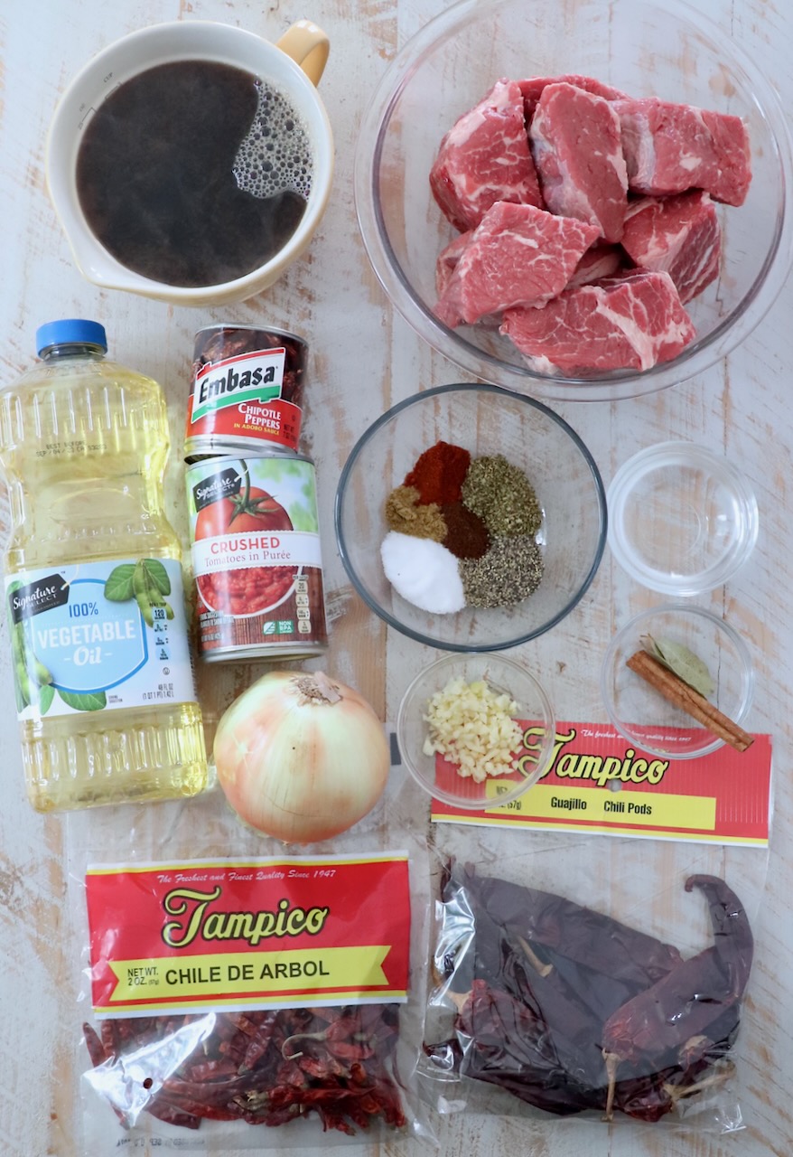 ingredients for birria on white wood board