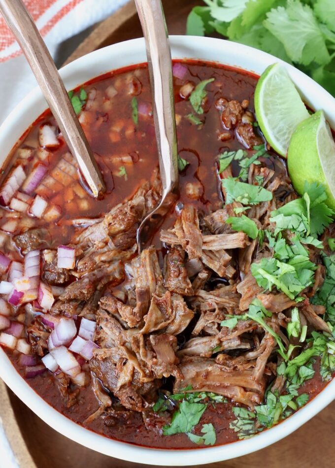 birria in bowl with forks