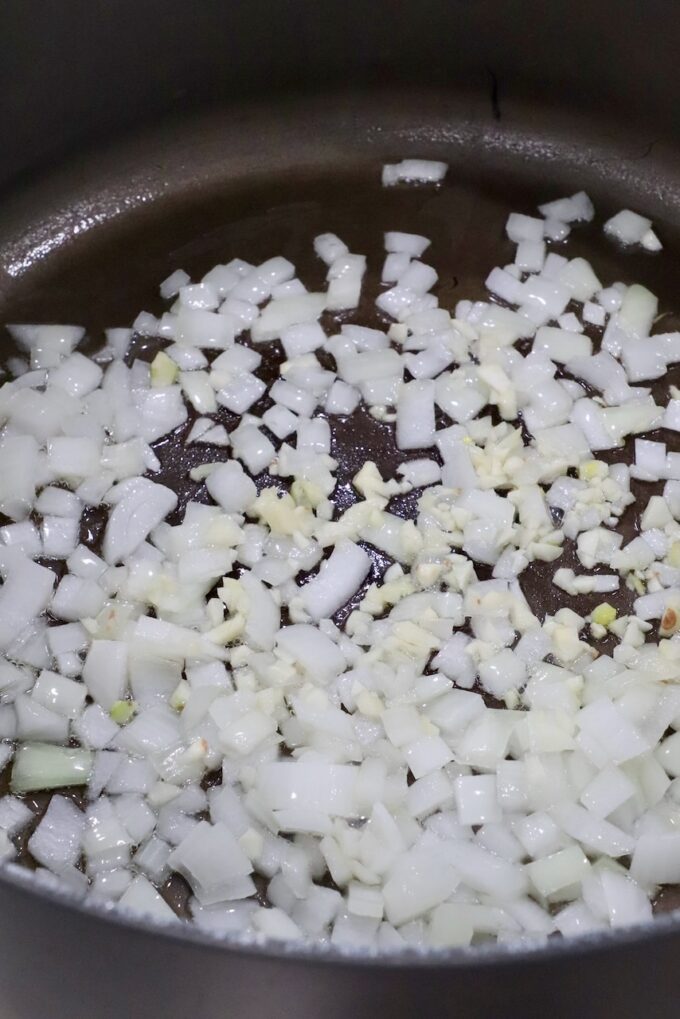 diced onions and minced garlic in large pan