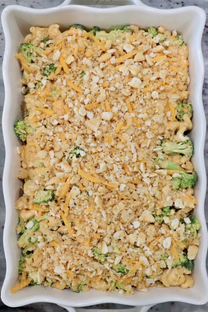 broccoli mac and cheese in casserole dish topped with Ritz cracker topping