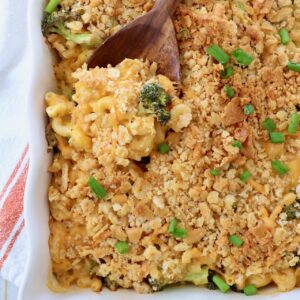 broccoli mac and cheese in casserole dish with serving spoon