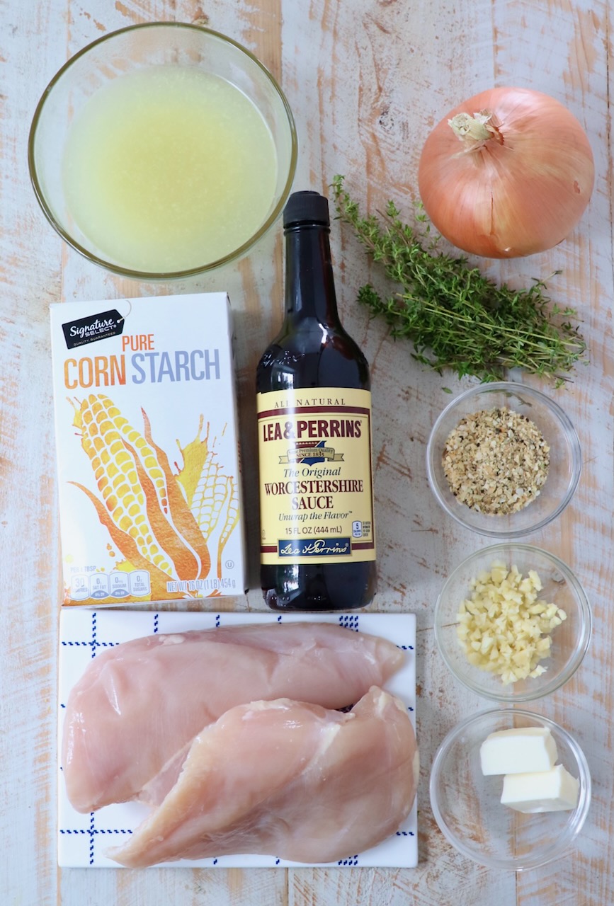 ingredients for french onion chicken on white wood board