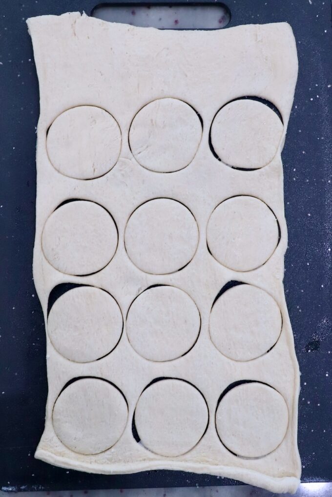 sheet of crescent roll dough cut into 12 rounds