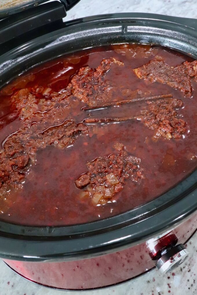 cooked birria in a slow cooker