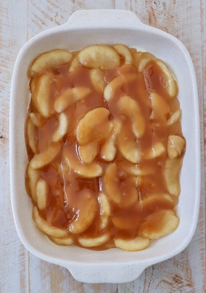 apple pie filling and caramel sauce in baking dish
