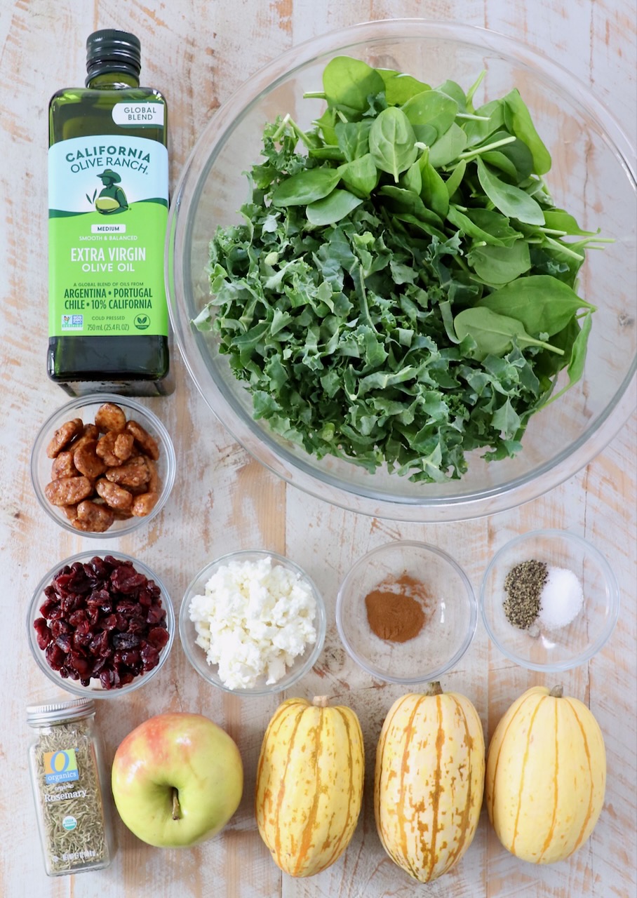 ingredients for delicata squash salad on white wood board