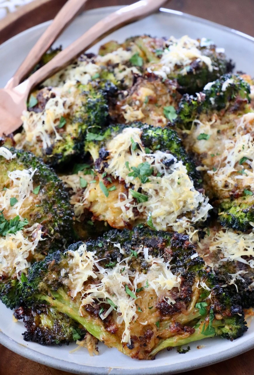 smashed broccoli on plate with forks