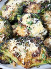 smashed broccoli topped with parmesan cheese on plate