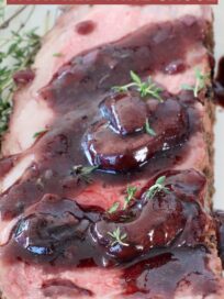 smoked new york strip steak on plate, covered in red wine sauce