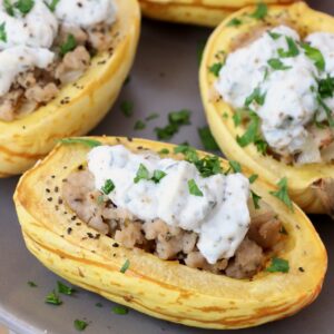 roasted delicata squash cut in half and filled with chicken sausage and ricotta cheese