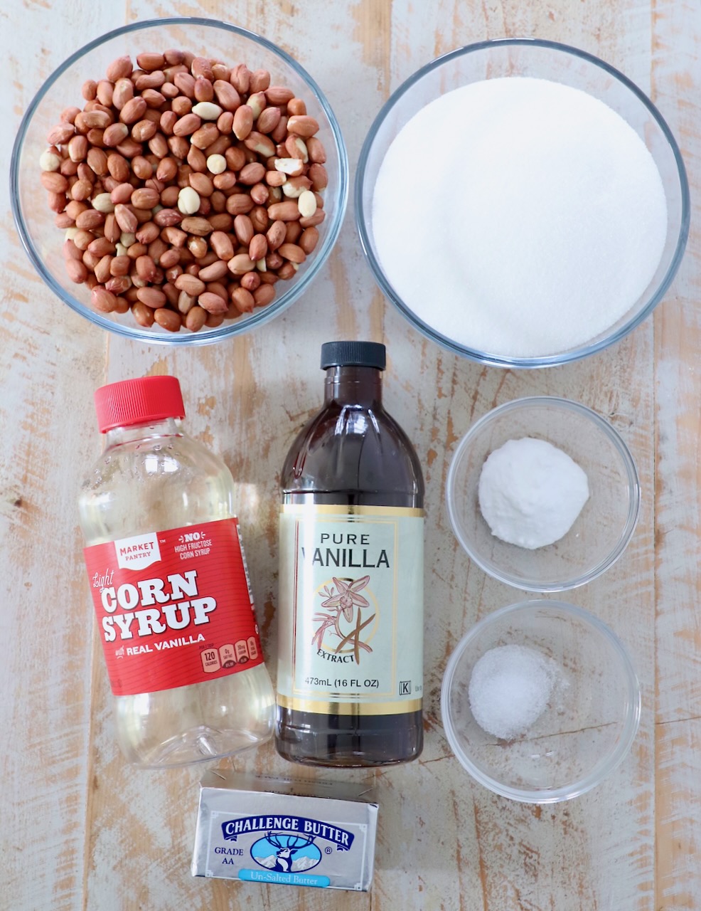 ingredients for peanut brittle on white wood board