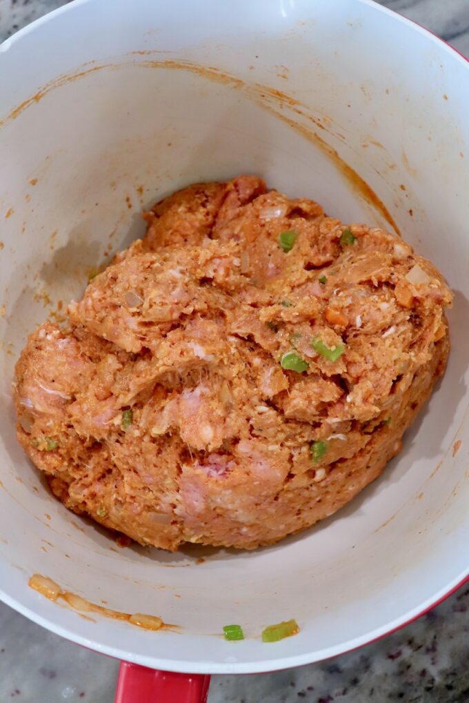 raw buffalo chicken meatball mixture in large bowl