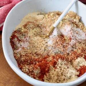 spices mixed with brown sugar in bowl with spoon
