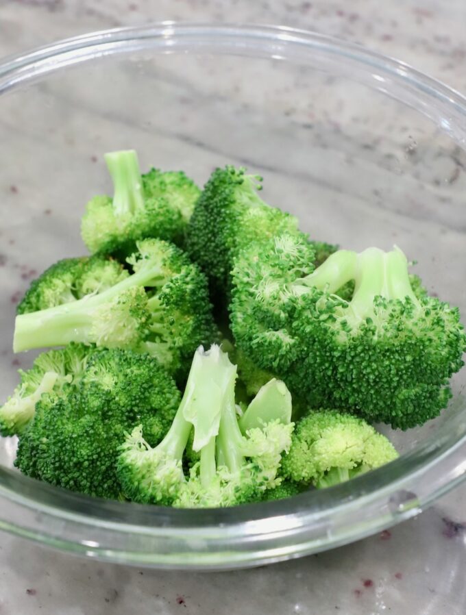 steamed broccoli in glass bowl