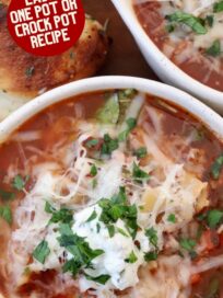 lasagna soup in bowls topped with ricotta cheese