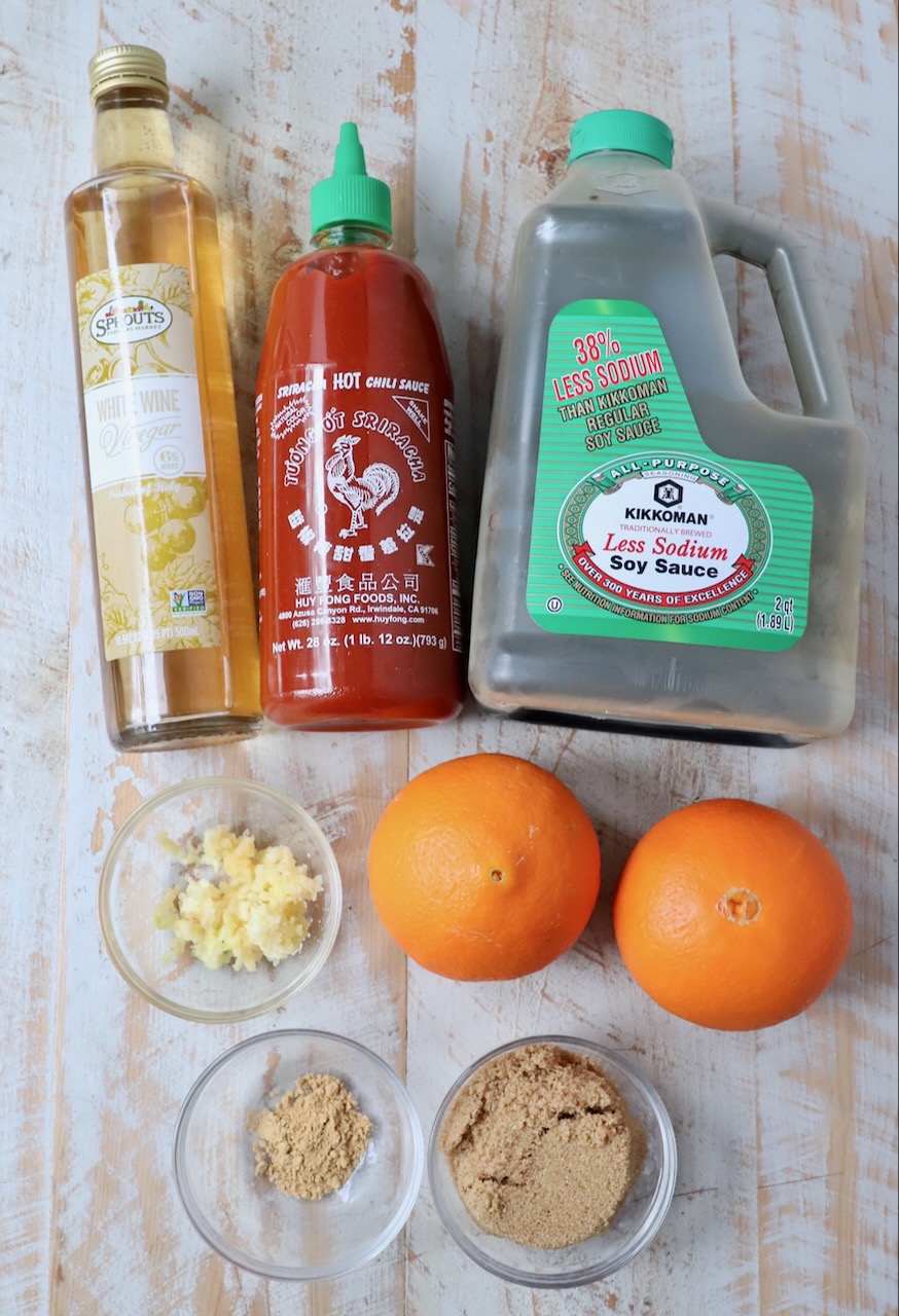 ingredients for Chinese orange sauce on white wood board