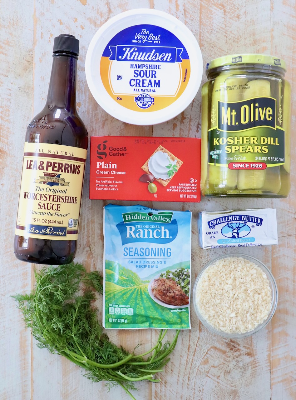 ingredients for pickle dip on white wood board