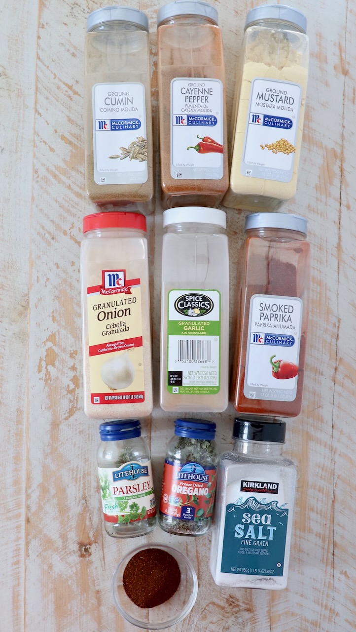 ingredients for southwest seasoning on white wood board