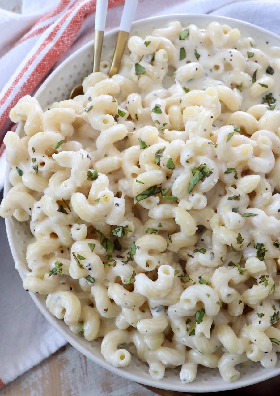 creamy cavatappi pasta in bowl with forks