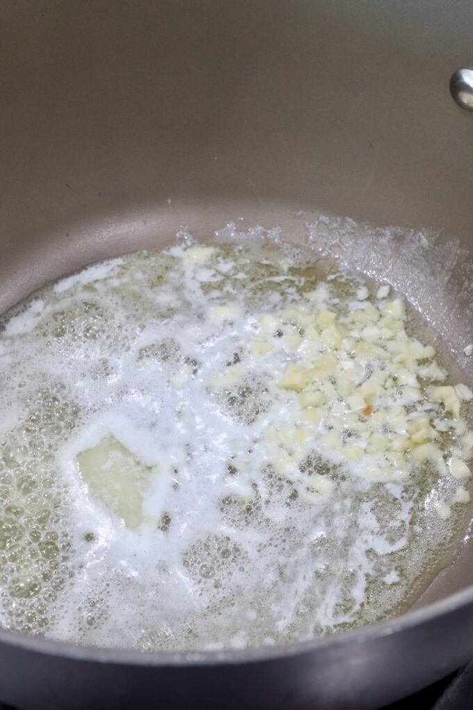 melted butter and minced garlic in saucepan