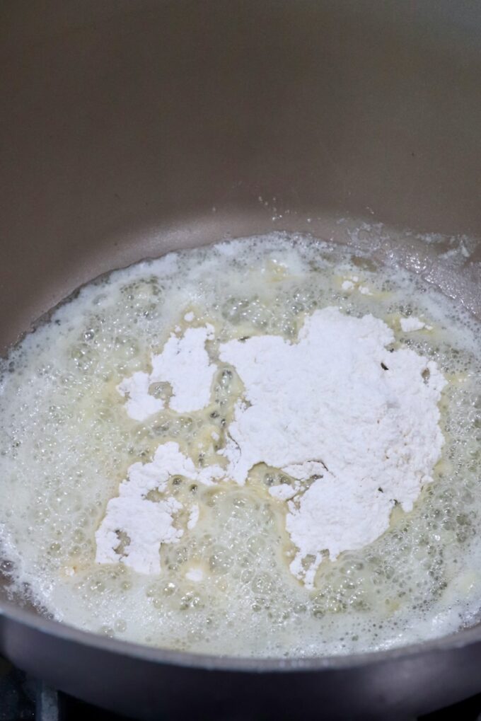 flour in melted butter in a saucepan