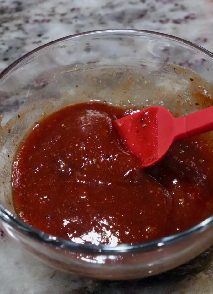 bbq sauce in bowl with pastry brush