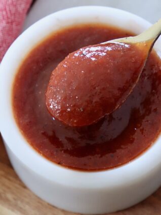 bbq sauce in bowl with small spoon