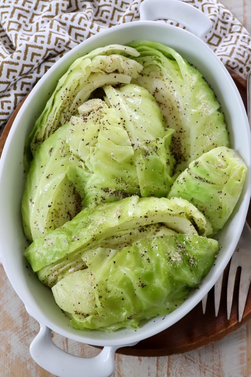 steamed cabbage wedges in serving dish