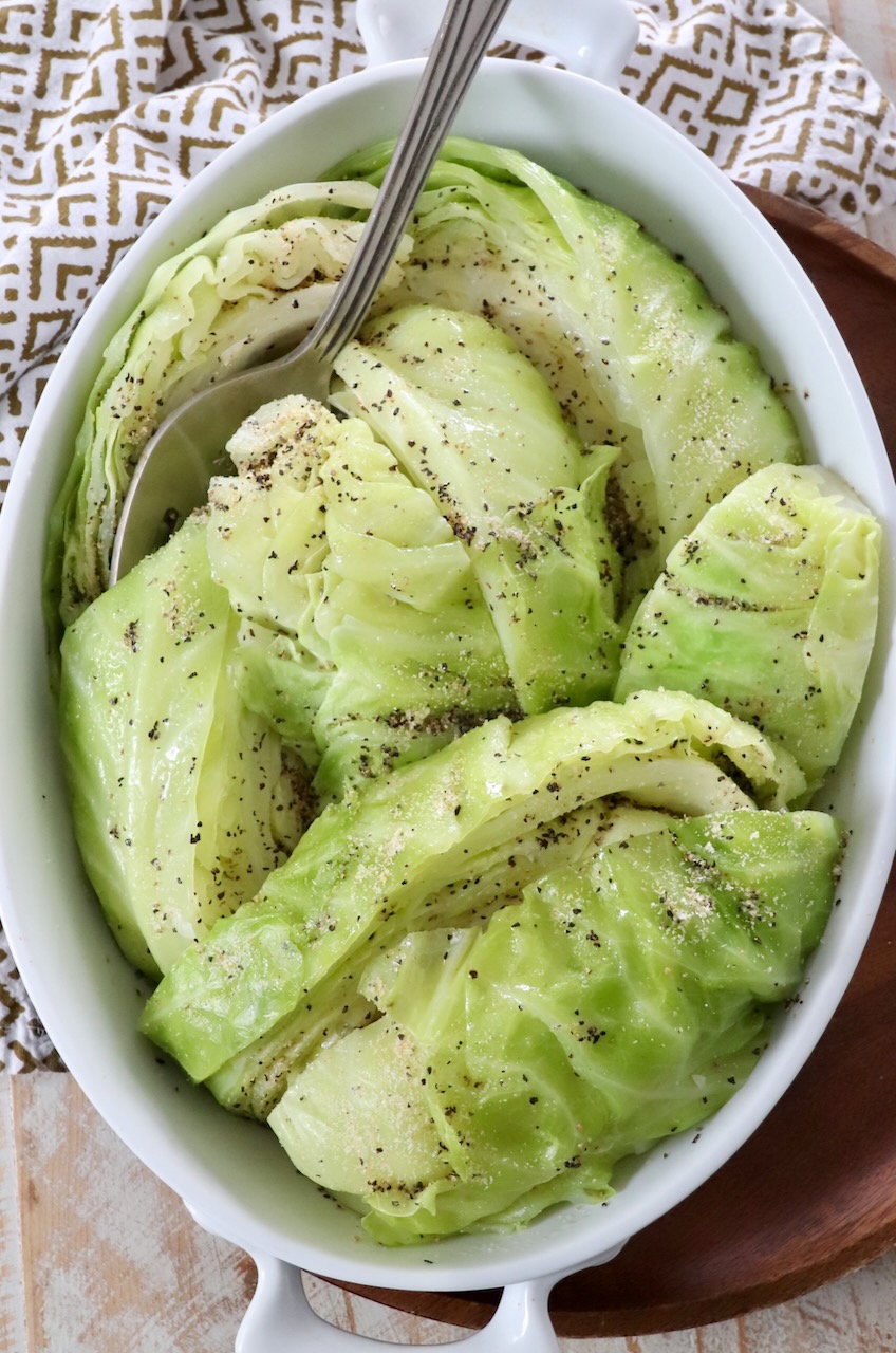steamed cabbage in serving dish with serving fork