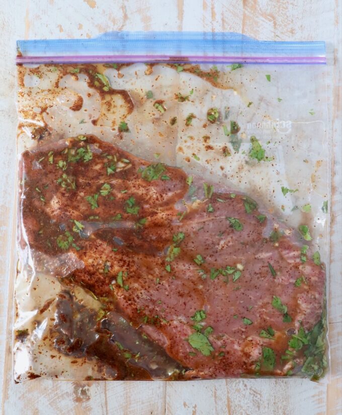 steak in marinade in zipper bag