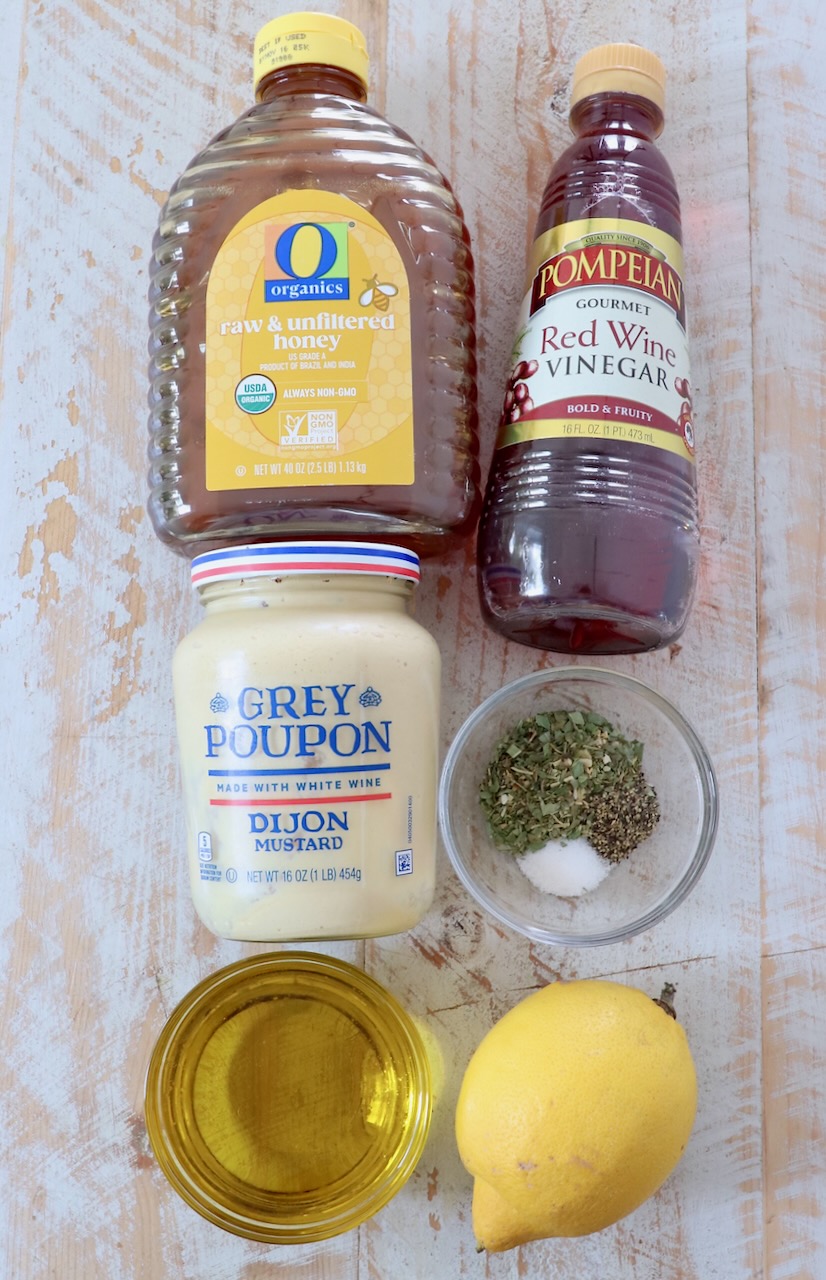 ingredients for Italian dressing on white wood board