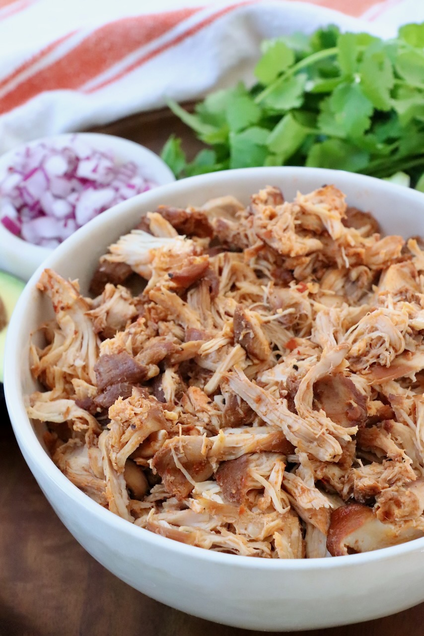 shredded, cooked chicken in bowl