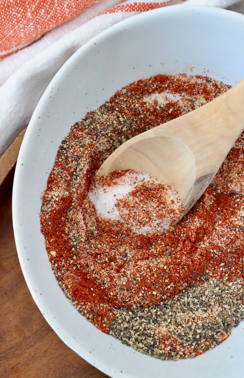 spices mixed together in bowl with wooden spoon