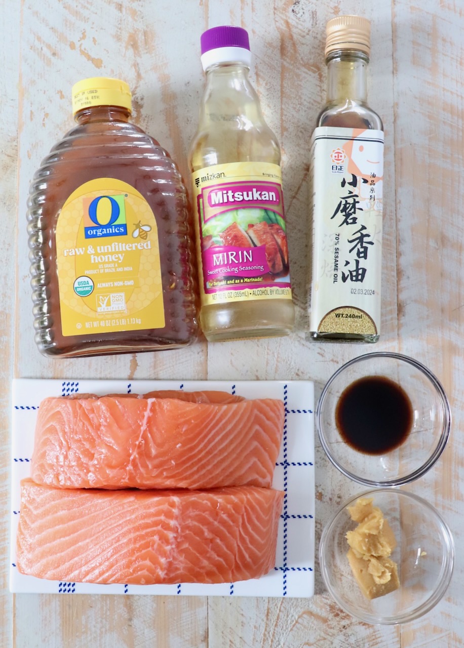 ingredients for miso glazed salmon on white wood board
