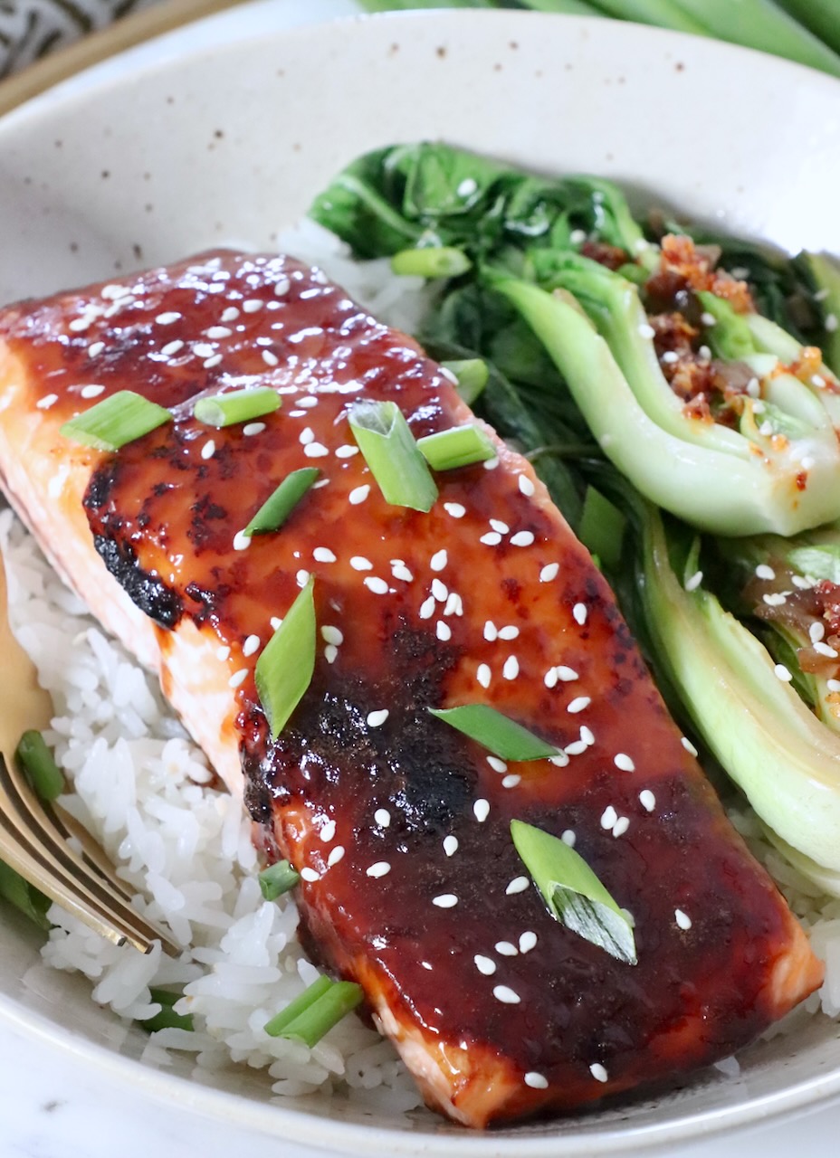 miso glazed salmon filet in bowl with white rice and bok choy