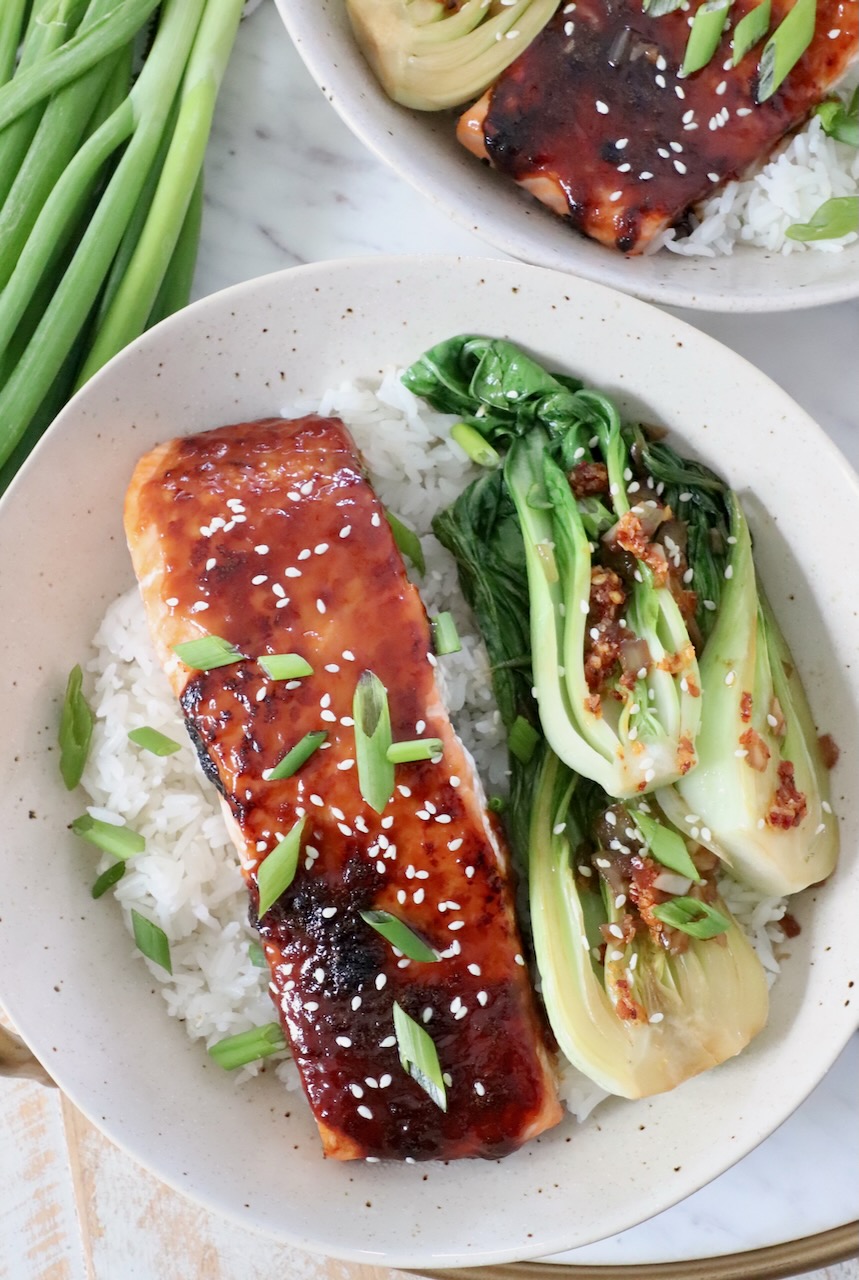piece of miso glazed salmon in bowl with rice and baby bok choy