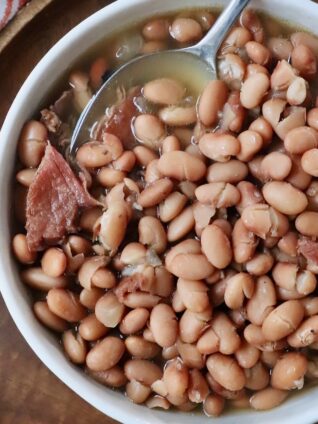 pinto beans in bowl with spoon