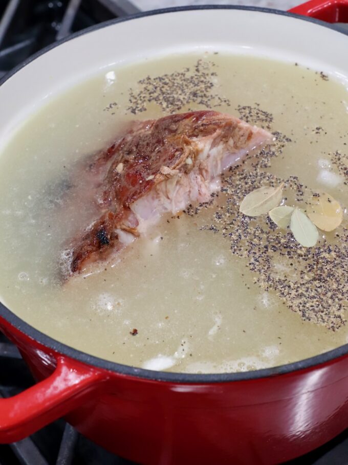ham bone in pot with broth and spices