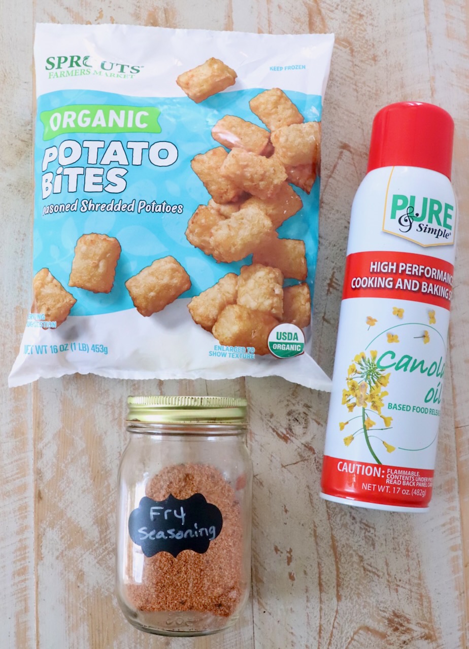 ingredients for air fryer tater tots on white wood board