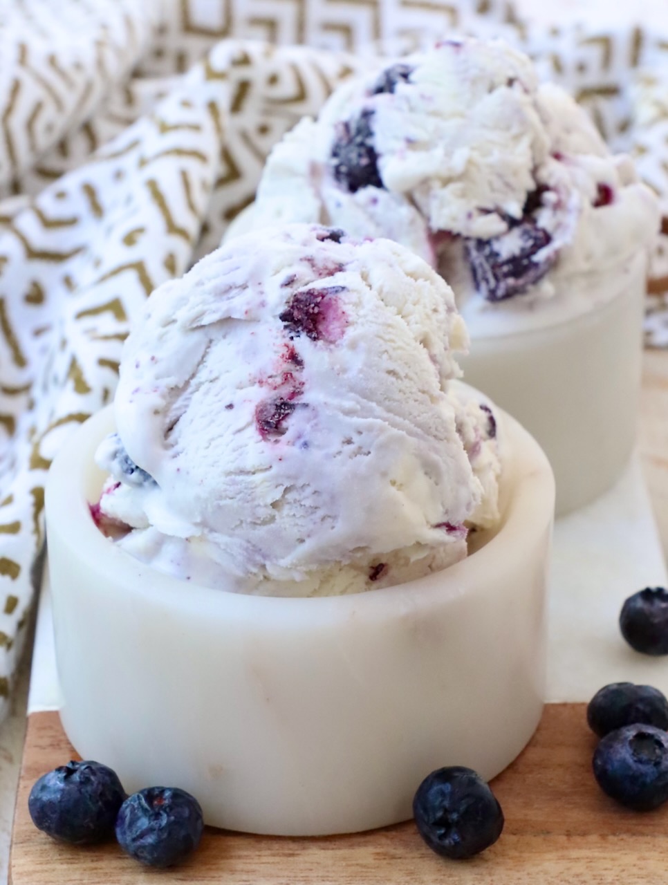 scoops of blueberry ice cream in small bowls