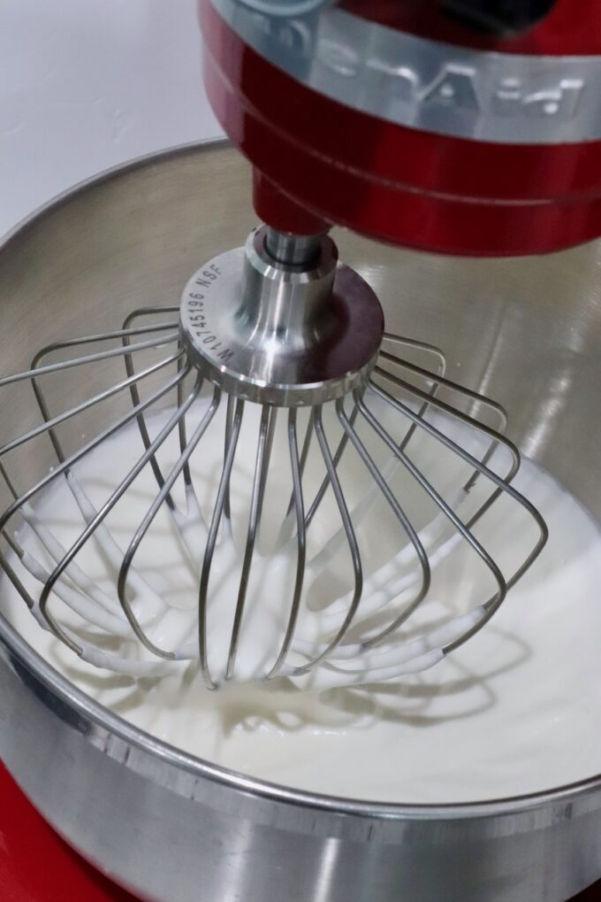 heavy cream in stand mixer with whisk attachment
