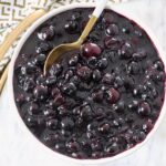 blueberry pie filling in bowl with spoon