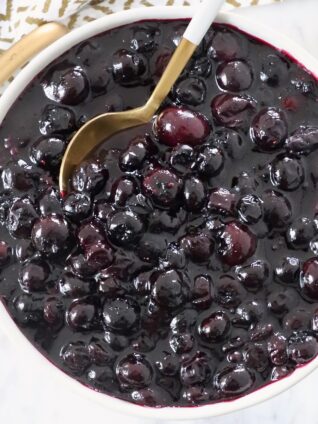 blueberry pie filling in bowl with spoon