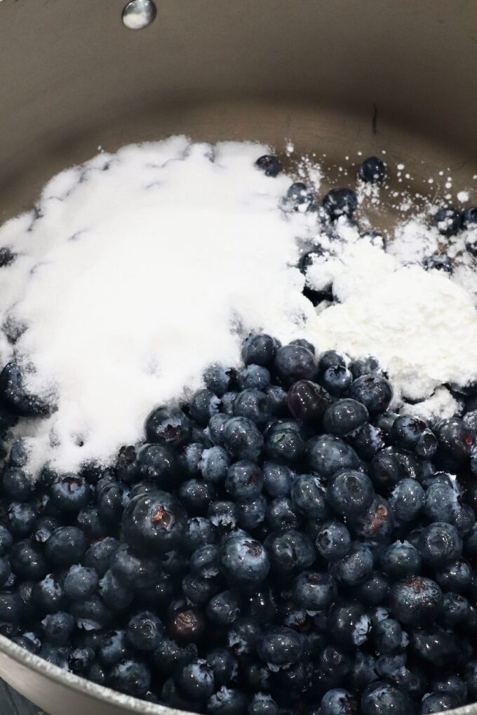 fresh blueberries and sugar in large pan